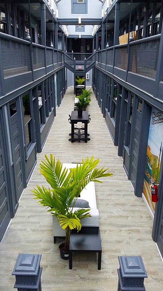 Renovated interior arcade and common area of a historic Cleveland mixed-use apartment building.